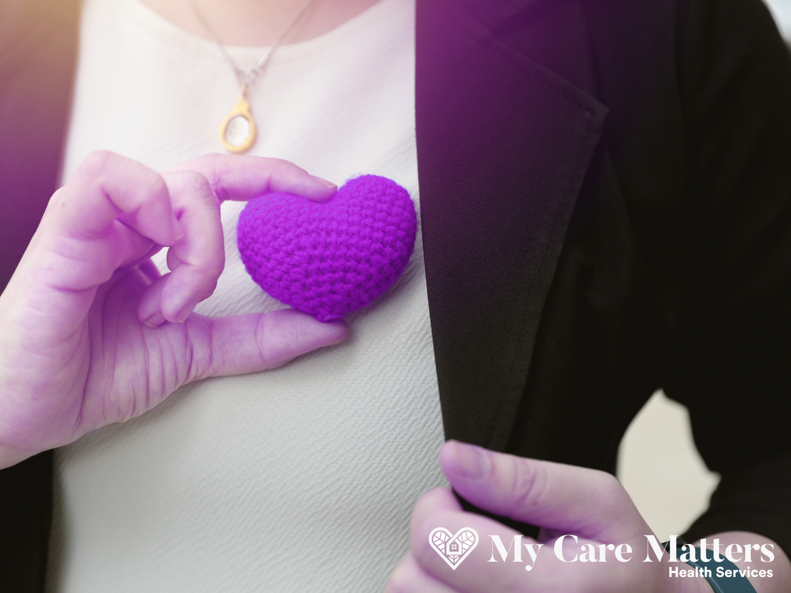 Woman holding a purple heart symbol representing compassionate heart care services by My Care Matters in Vancouver